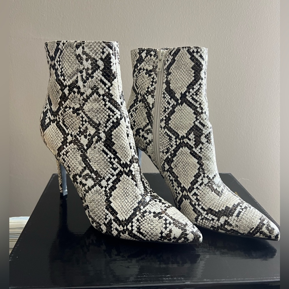 Snake print leather heeled boots
